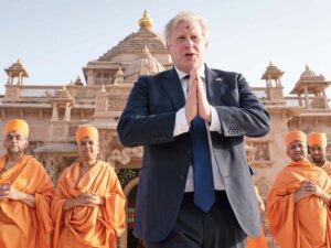 British Prime Minister Boris Johnson walks with sadhus Hindu holymen as he visits the Swaminarayan Akshardham temple in Gandhinagar Ahmedabad. 1804ca150c9 original ratio